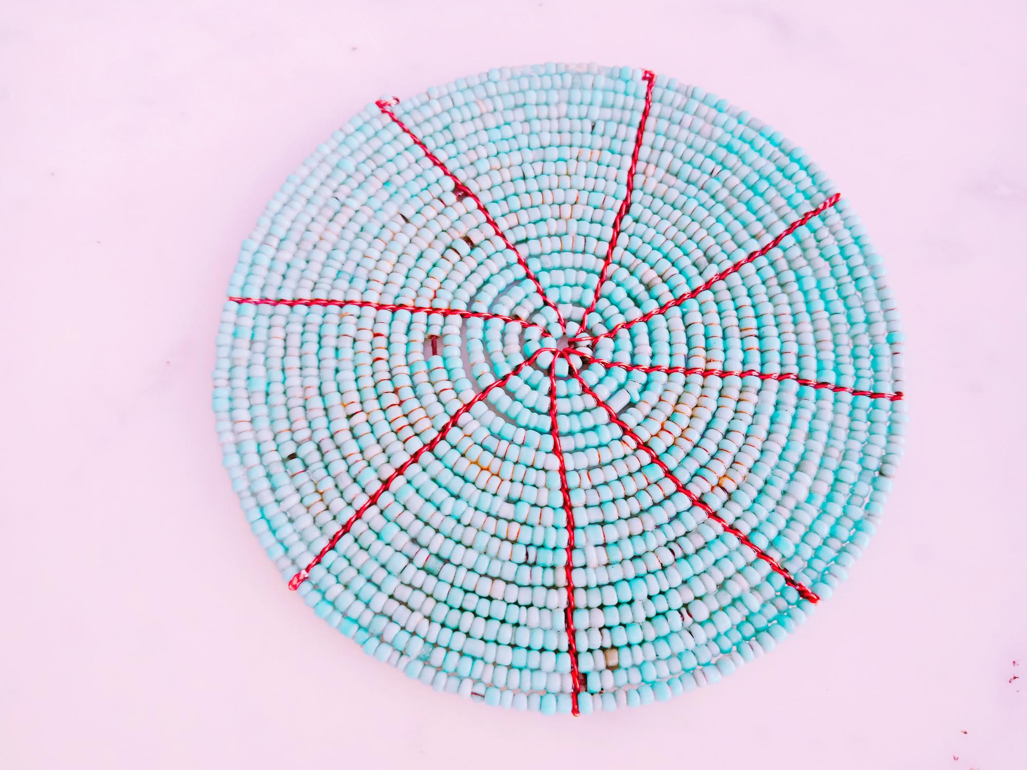round sampler hoop with layered stitches