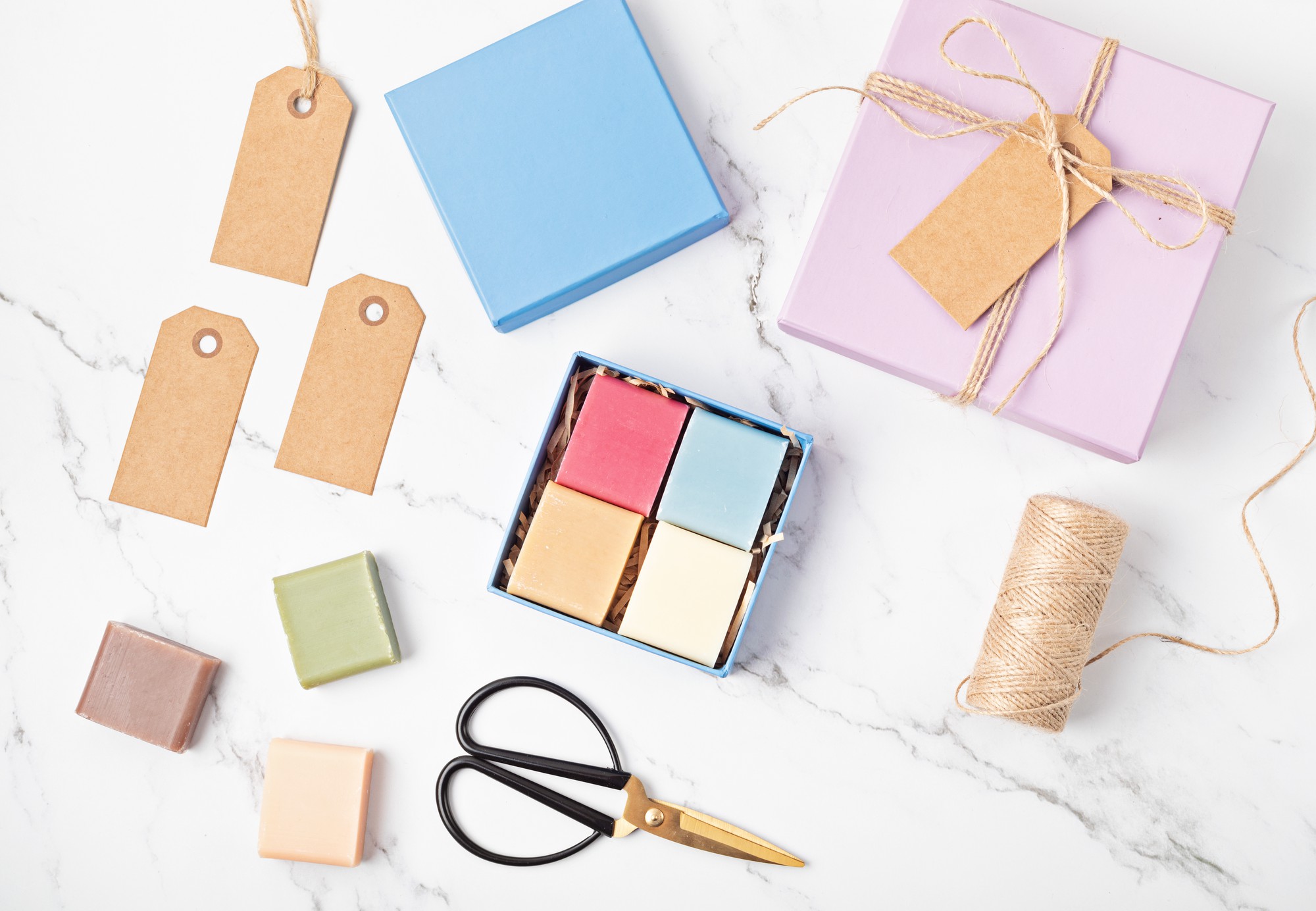 flatlay of monthly sampler packages with pastel labels